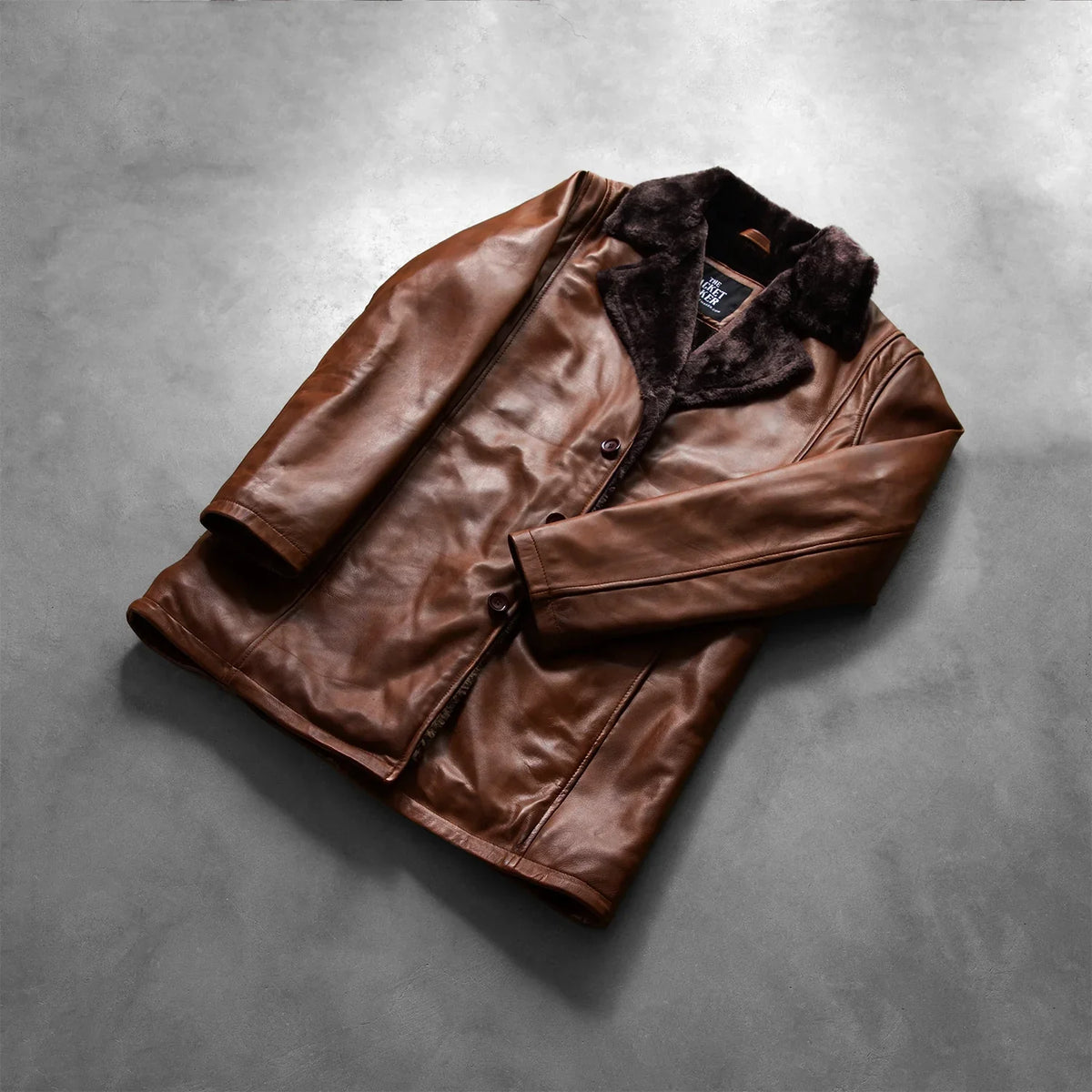Open Hem &amp; Hem Craftsmanship Construction Detail on Men's Cinnamon Distressed Leather Fur Coat