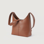 
The Stefani Brown Leather Hobo Bag For Women - Вид сбоку, демонстрирующий эргономичный крой рукава